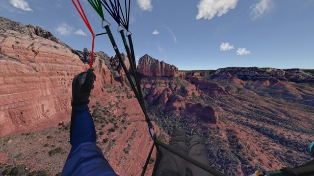 First-person view over red rock canyon walls