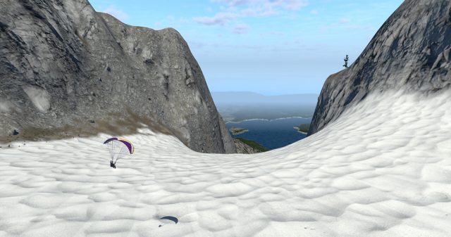 Speed flying down a snowy couloir